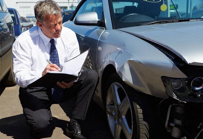 insurance agent discussing policy options with couple